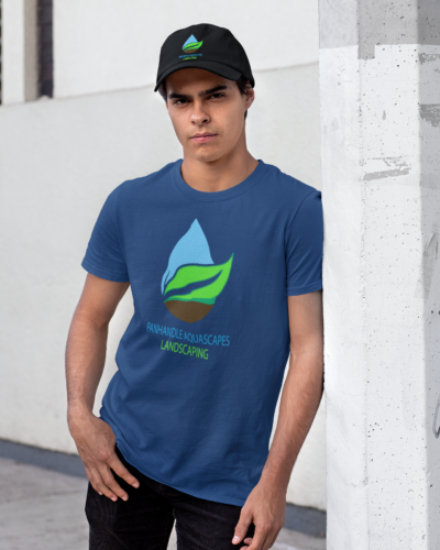 tee-mockup-featuring-a-man-with-a-dad-hat-leaning-against-a-light-pole-31172 tee-mockup-featuring-a-man-with-a-dad-hat