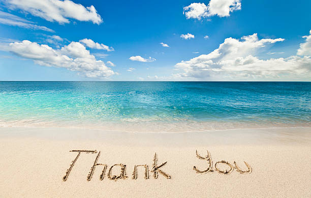"Thank You" text writen on the beach. Thank You on Beach Sand